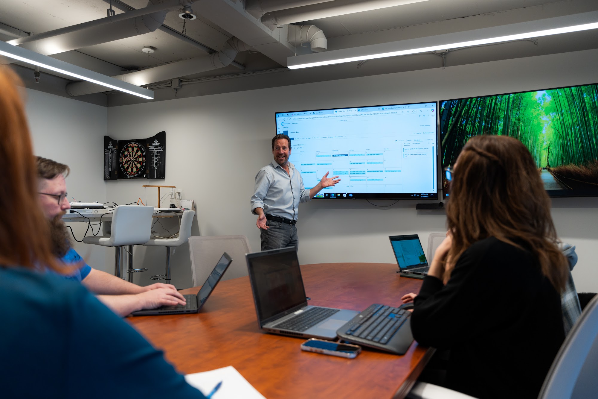 LAN team reviewing business technology in the office