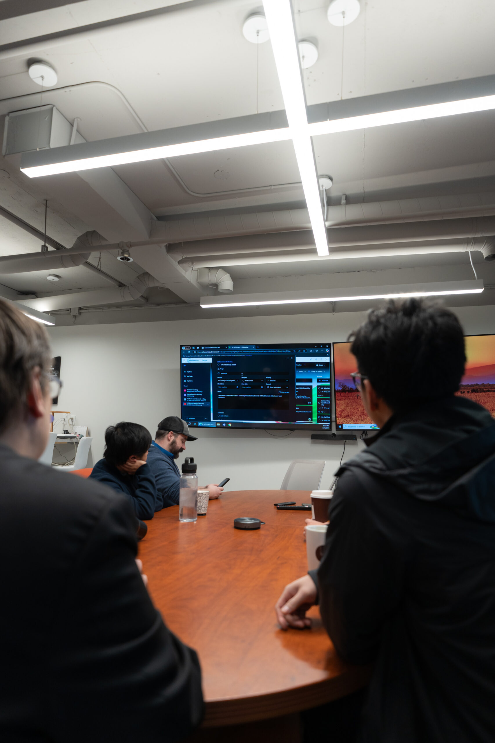 LAN team reviewing information in the boardroom