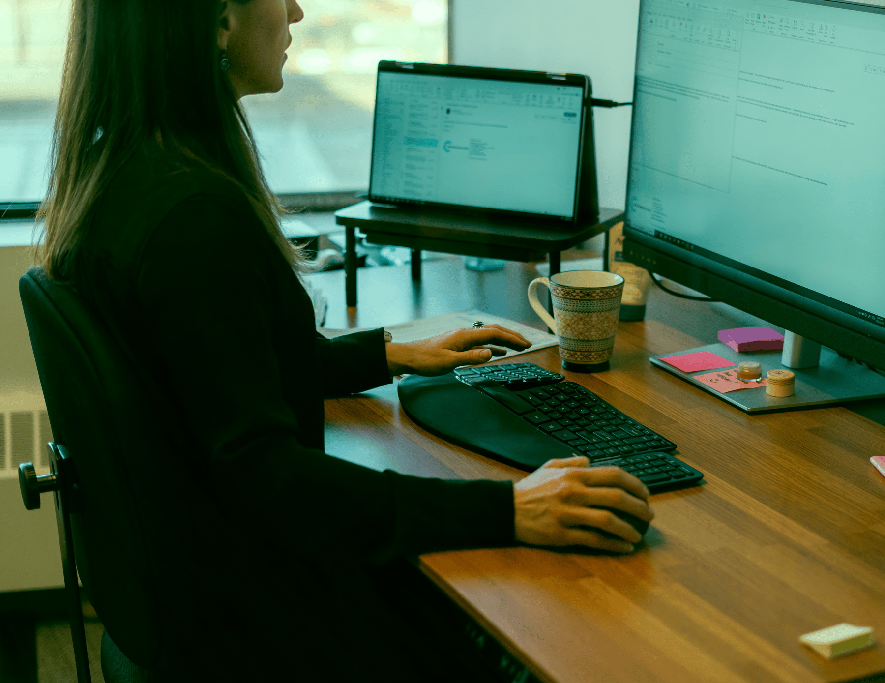 LAN team member working through a plan at her desk