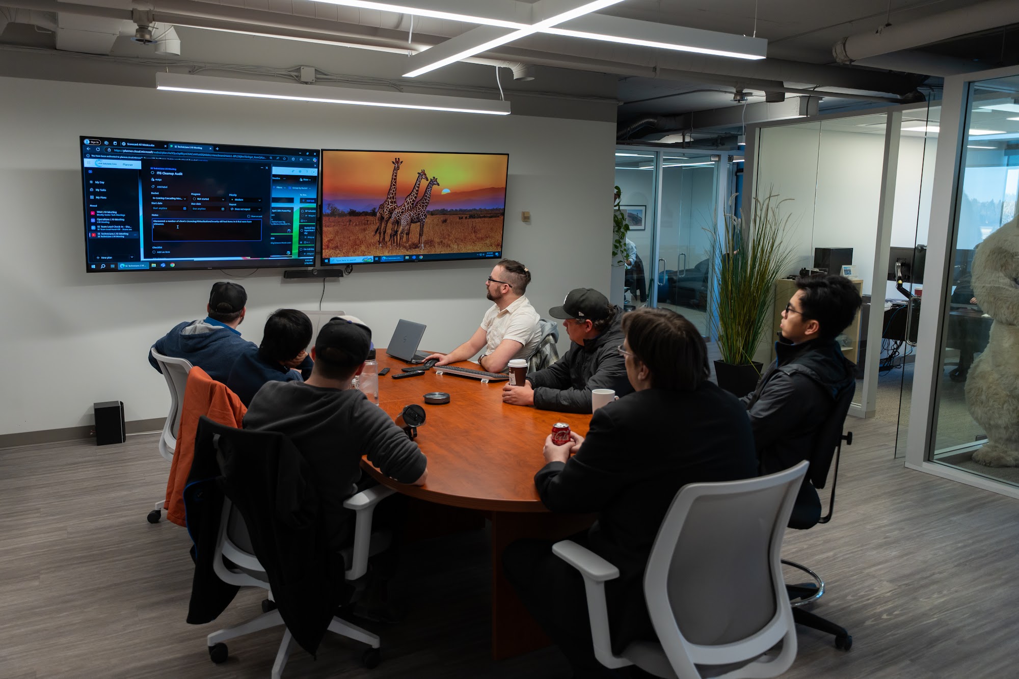 LAN team reviewing technology together during an office meeting