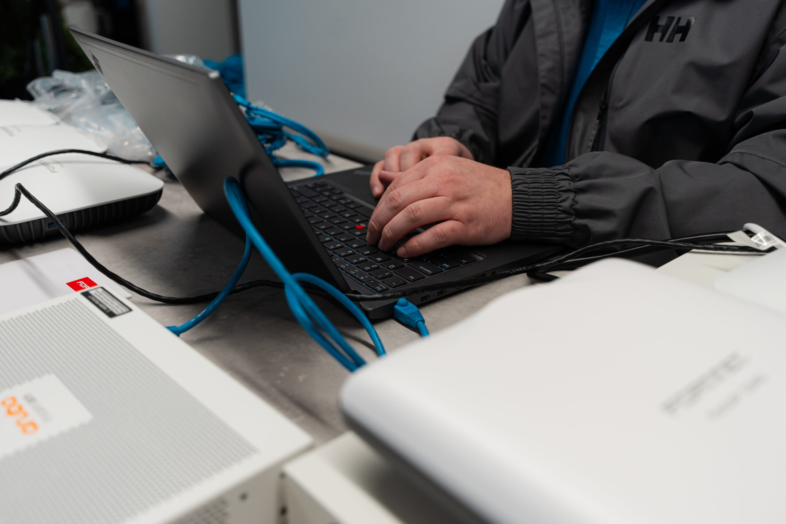 LAN technician working on business equipment
